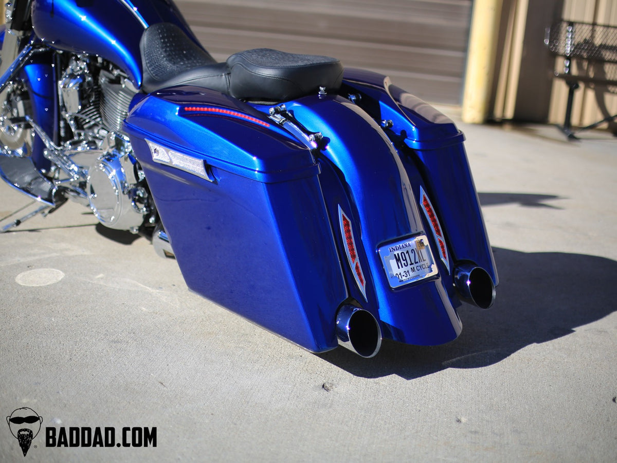 Close-up of blue custom lid with LED taillight on a Road King