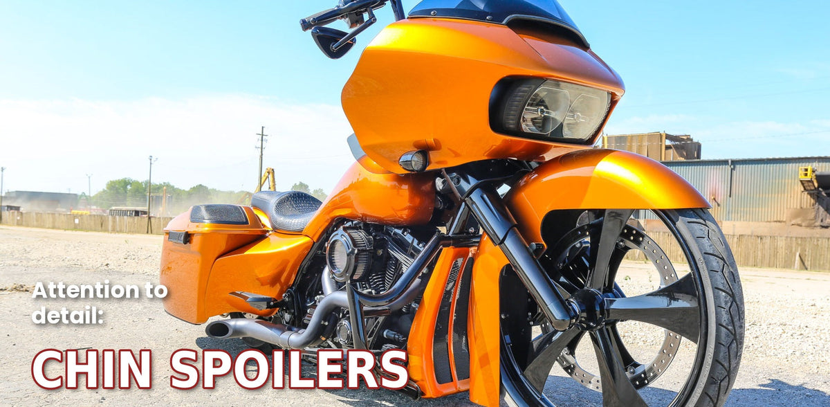 Bad Dad chin spoiler installed on an orange Harley-Davidson bagger, close-up of the front end with 'Attention to detail: Chin Spoilers' banner text