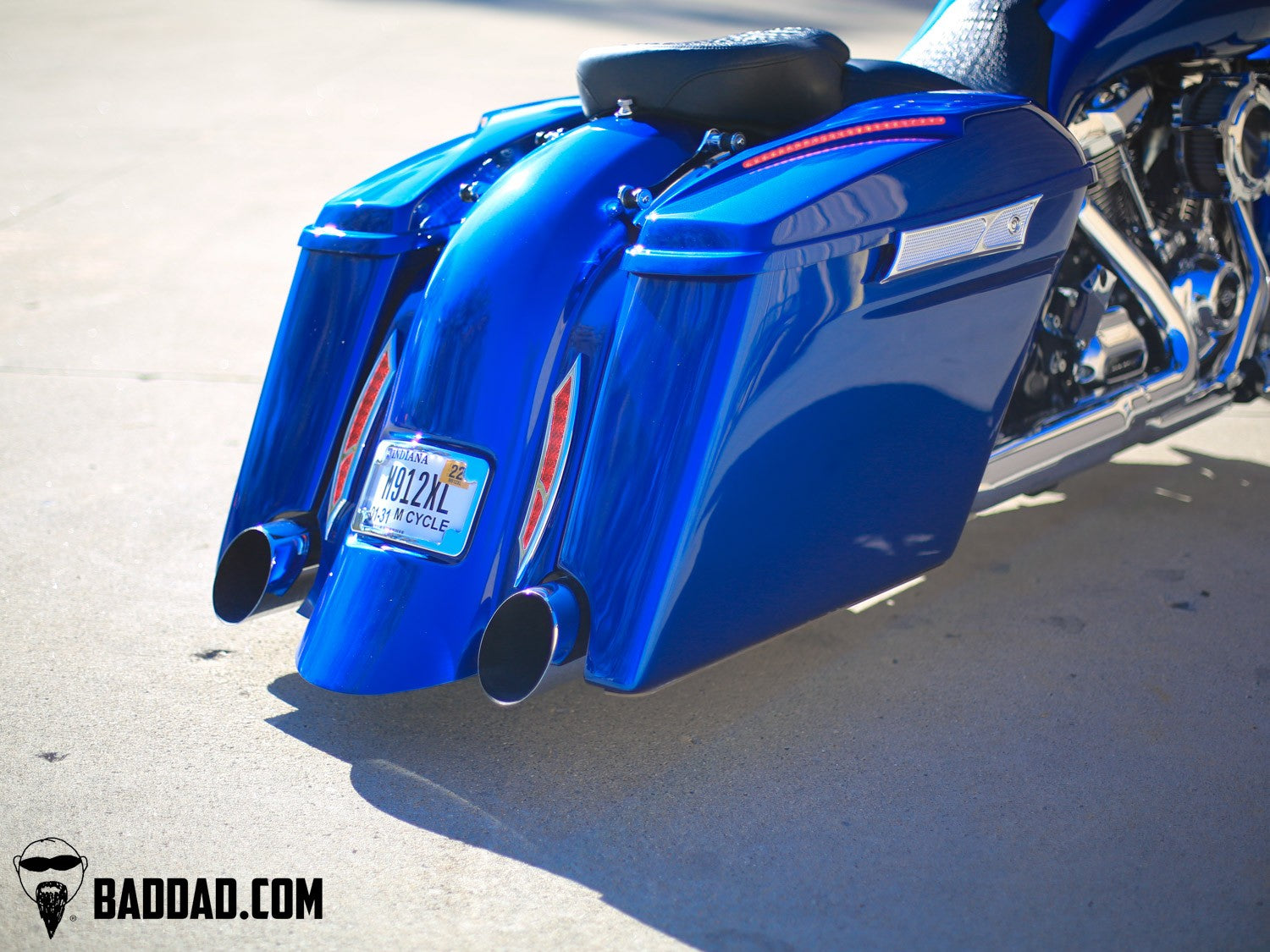 Low angle view of blue custom saddlebag lids on a Street Glide