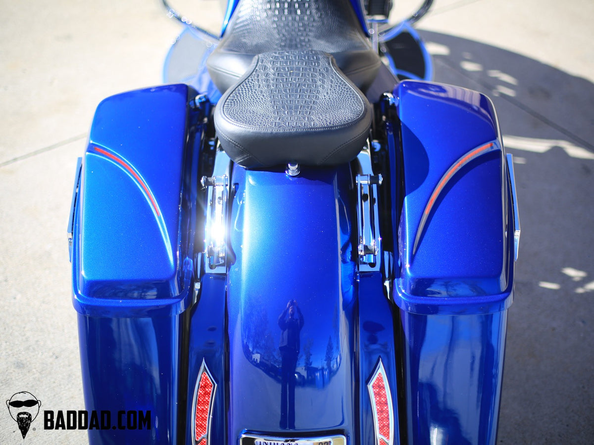 Top-down view of blue saddlebag lids with LED taillights on a Road Glide