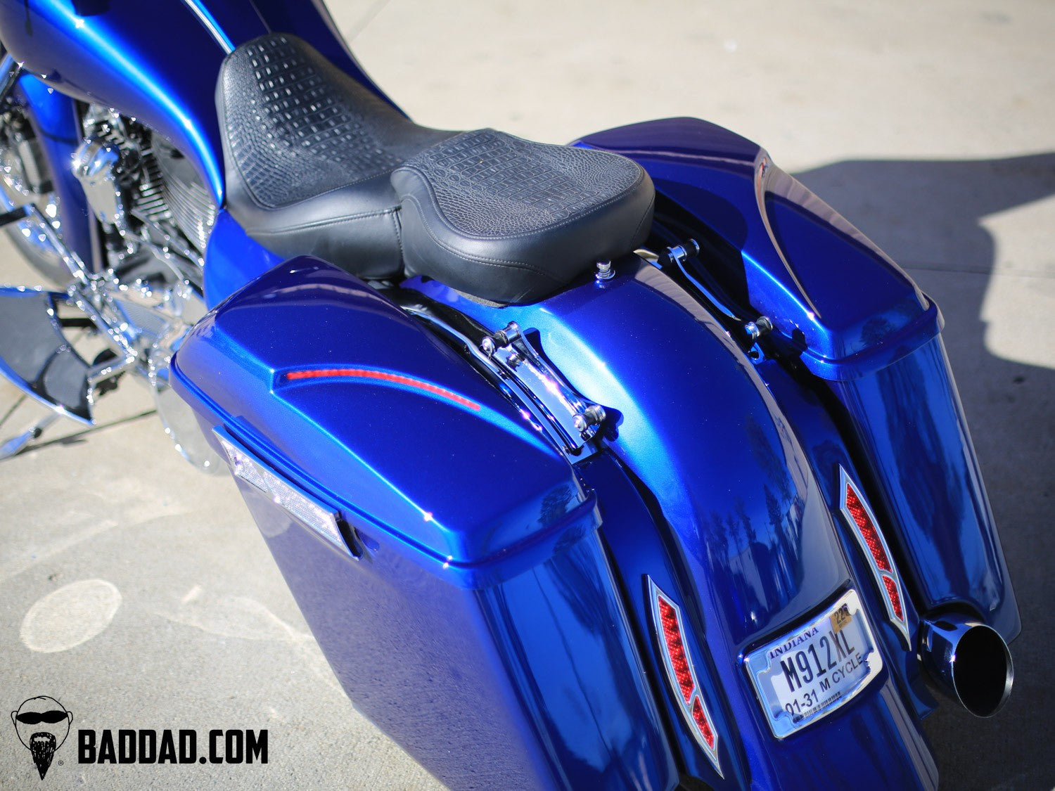 Top-down view of custom lids and seat on a blue Electra Glide bagger