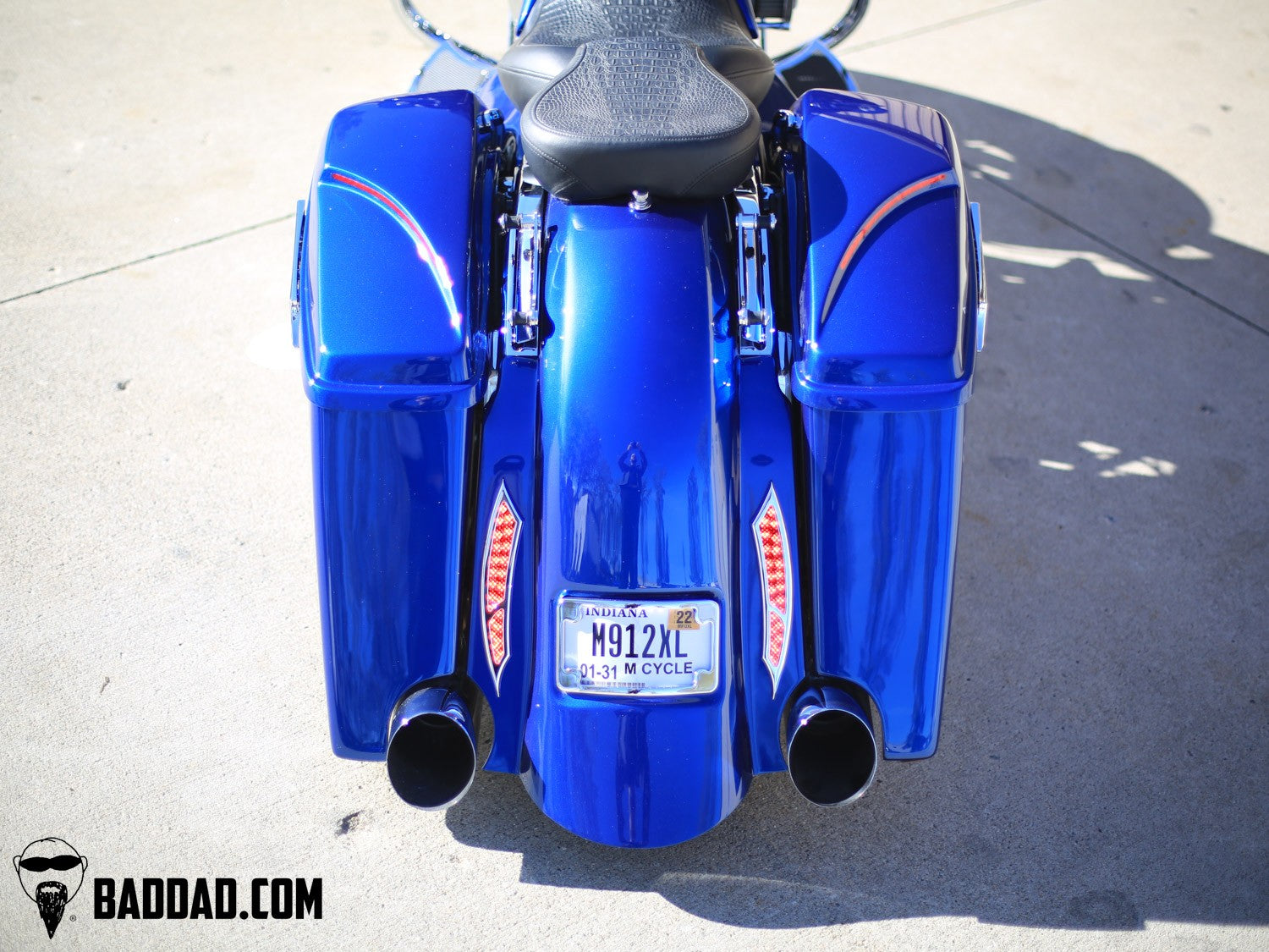 Rear view of blue Street Glide with custom saddlebag lids and LED taillights